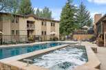 Enjoy a refreshing dip in the sparkling blue pool or relax in the bubbling hot tub at this inviting property.