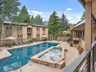 Experience luxury living with this stunning property featuring a sparkling swimming pool and a relaxing hot tub, perfect for unwinding.