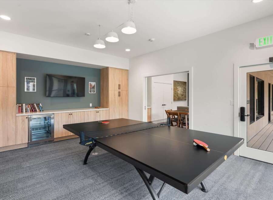 Enjoy leisure and entertainment in this vibrant community space, featuring a professional ping pong table perfect for friendly competitions.