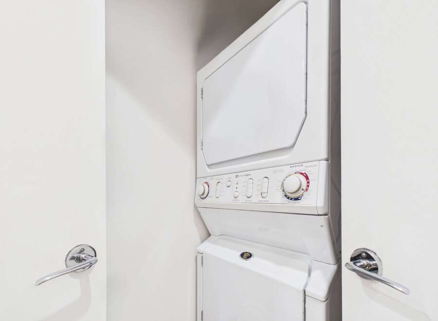 This stacked Maytag washer and dryer unit is perfect for maximizing space in your laundry room.