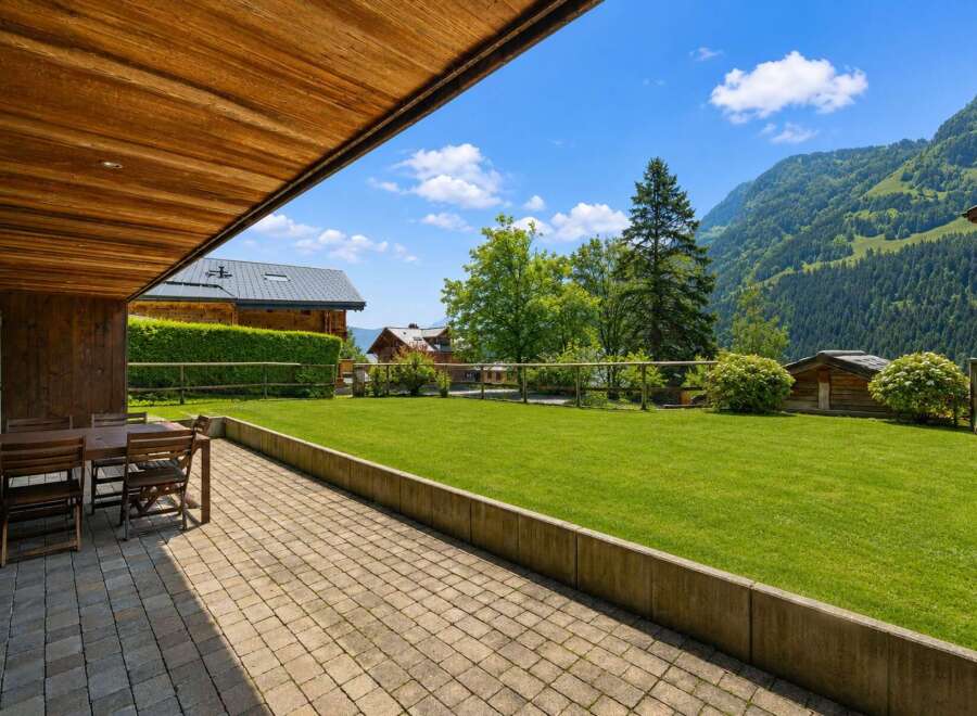 Enjoy breathtaking mountain views from this charming property's patio, perfect for al fresco dining.