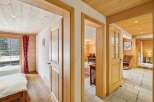 Step into a charming mountain retreat featuring cozy wooden interiors and bright, inviting spaces.