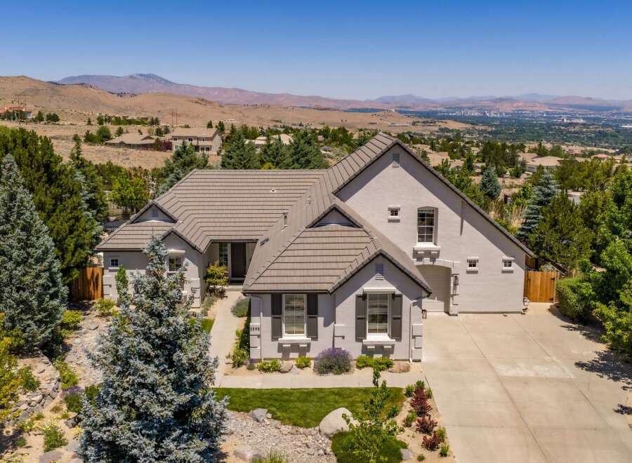 Experience luxury living in this stunning custom-built home, nestled in a picturesque landscape with breathtaking panoramic views.