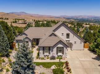 Experience luxury living in this stunning custom-built home, nestled in a picturesque landscape with breathtaking panoramic views.