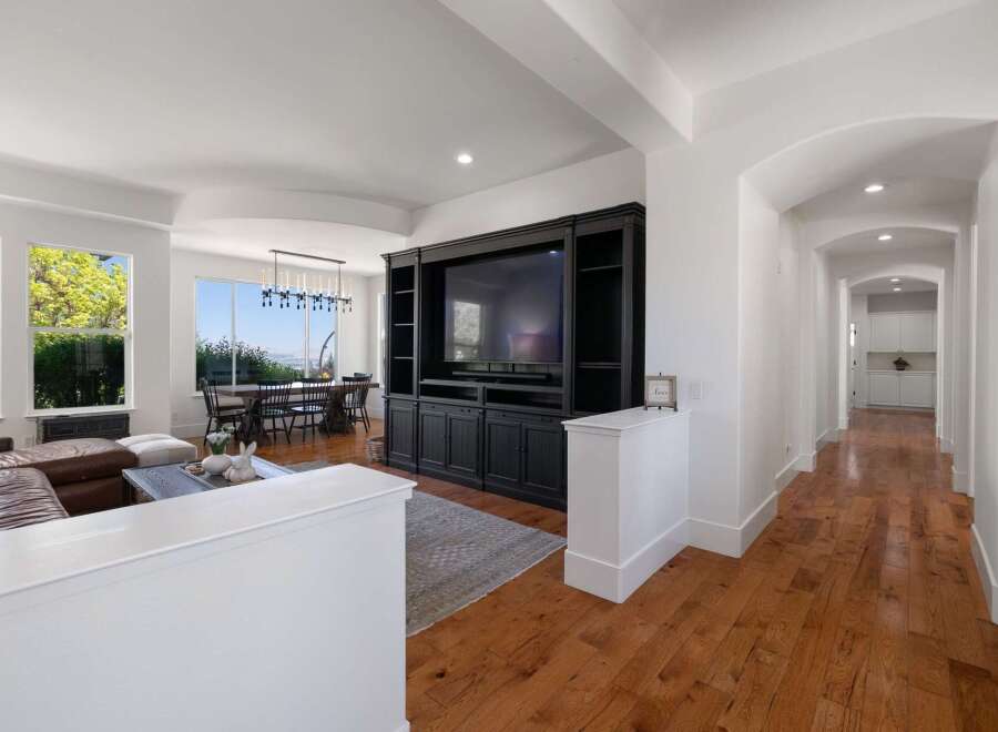 Experience elegant living in this spacious home featuring a large open-concept living and dining area with stunning views.