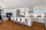 Experience luxury and comfort in this stunning open-concept kitchen and living area.