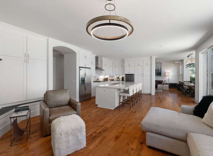 Experience modern living in this open-concept home featuring a gourmet kitchen with a large island and ample cabinet space.