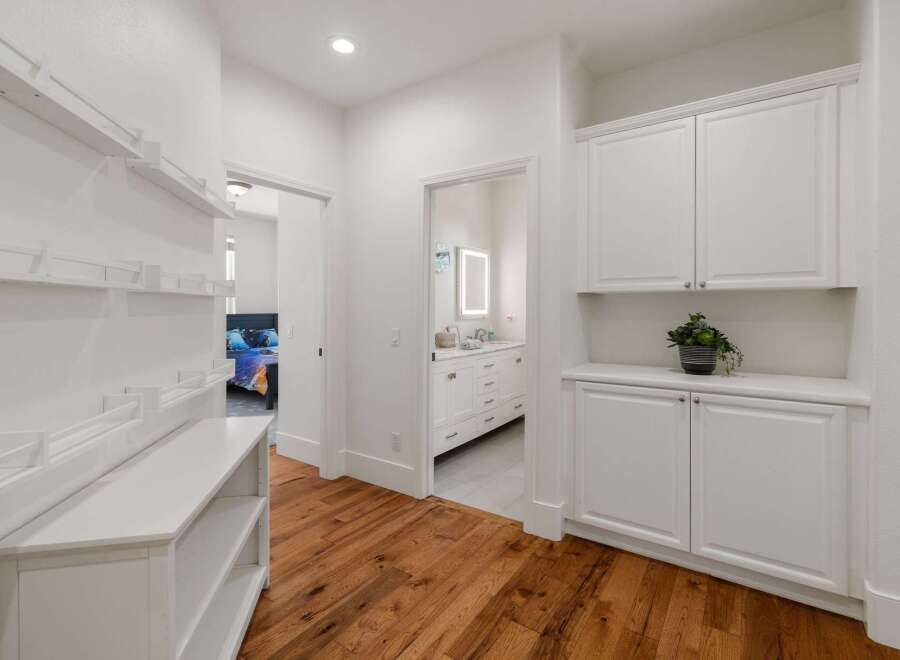 This hallway features a modern design with ample storage solutions.