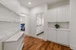 This hallway features a modern design with ample storage solutions.