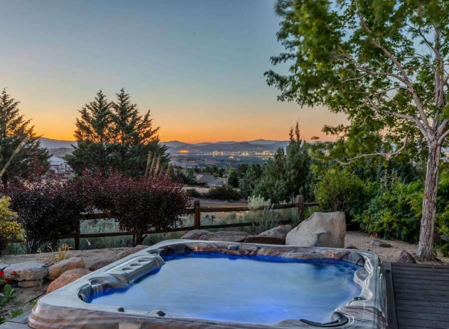 Experience ultimate relaxation with this stunning hot tub, perfectly situated to offer breathtaking panoramic views of the city lights and surrounding mountains.