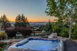 Experience ultimate relaxation with this stunning hot tub, perfectly situated to offer breathtaking panoramic views of the city lights and surrounding mountains.