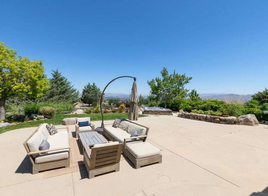 Enjoy breathtaking panoramic views from this stunning backyard oasis, perfect for entertaining or relaxing.
