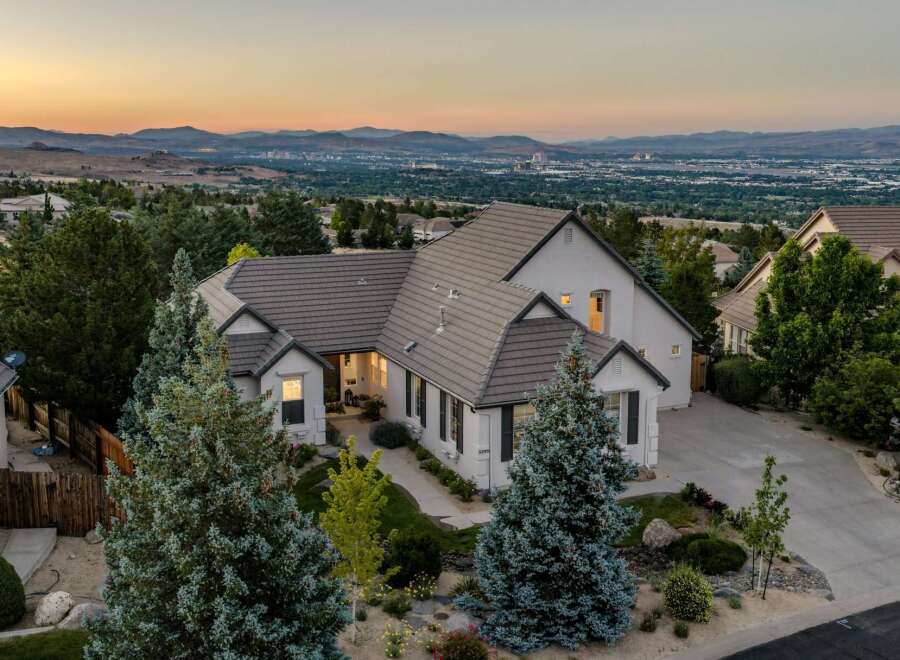 Experience luxury living in this stunning estate, boasting panoramic views of the city and mountains.
