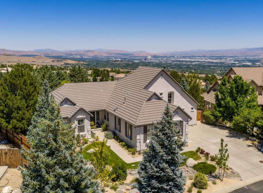 Experience luxury living in this stunning home with breathtaking panoramic views of the valley and mountains.