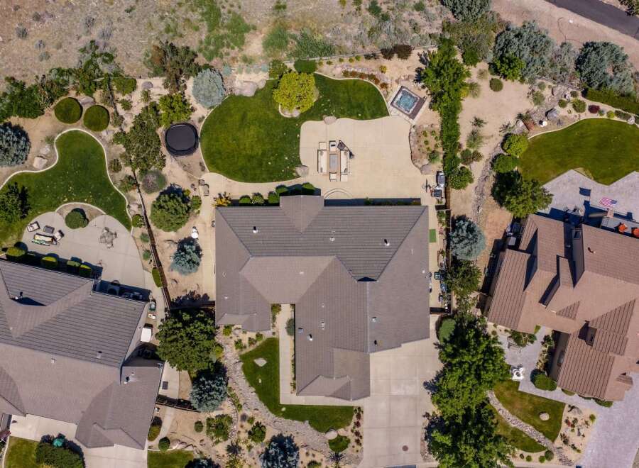 Experience luxury outdoor living with this stunning aerial view showcasing a sprawling backyard oasis.