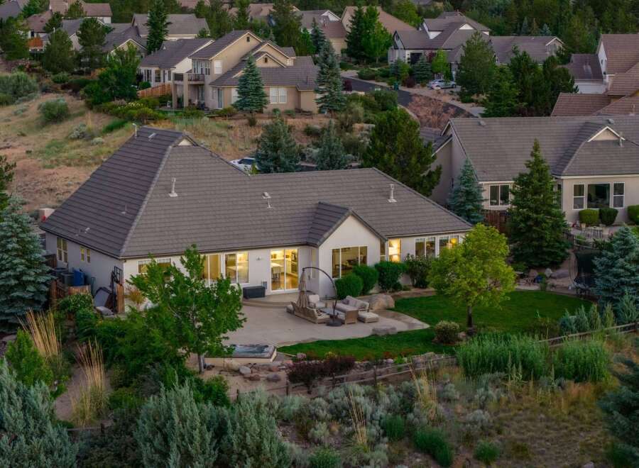 Experience luxury living in this stunning home, featuring a spacious backyard with a relaxing hot tub and an inviting patio perfect for entertaining.