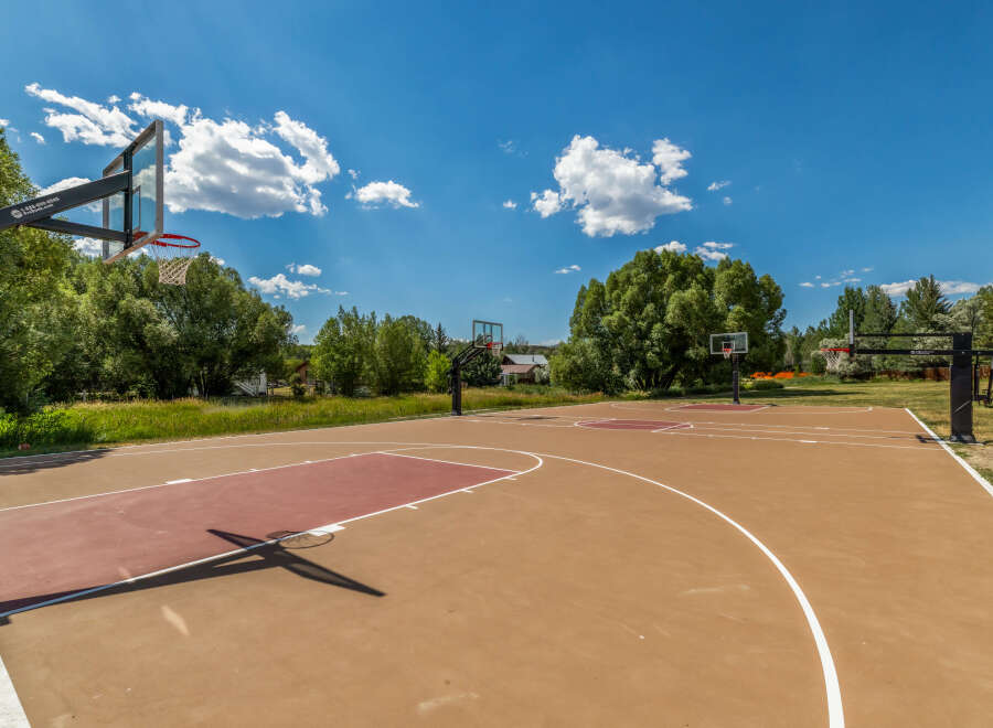 Enjoy outdoor recreation with this spacious basketball court, perfect for friendly games and practice.