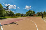 Enjoy outdoor recreation with this spacious basketball court, perfect for friendly games and practice.