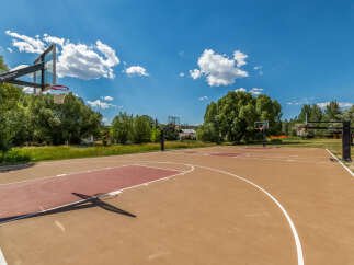 Enjoy outdoor recreation with this spacious basketball court, perfect for friendly games and practice.
