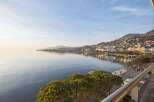 Experience breathtaking lakefront living with panoramic views of the serene waters and a charming hillside city.