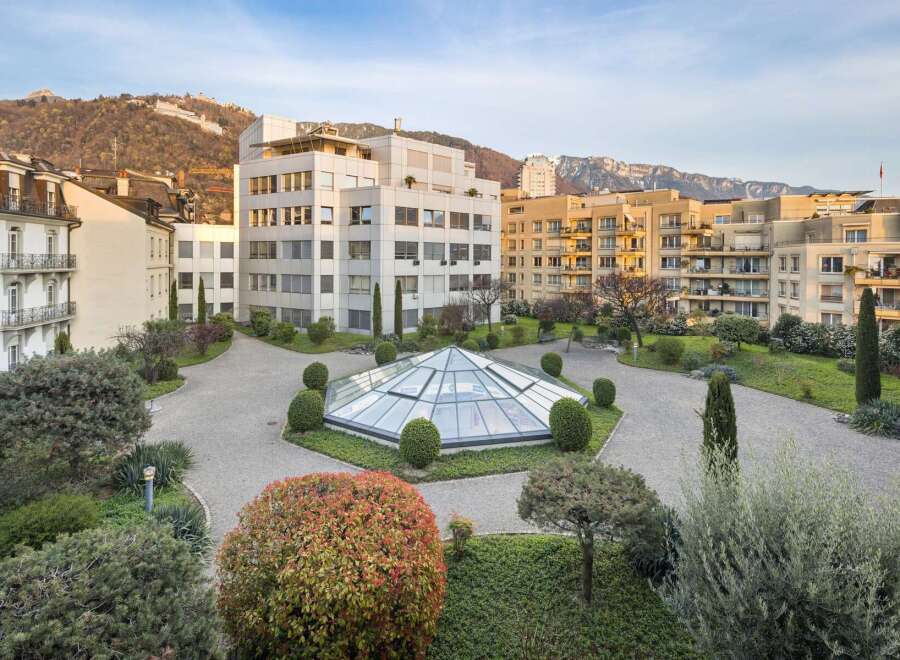 Discover this stunning property featuring a modern architectural design with a unique glass-domed atrium at its center.