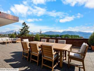 Enjoy breathtaking mountain views from this expansive patio, perfect for outdoor dining and entertaining.