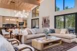 Experience modern luxury in this stunning open-concept living space, featuring a spacious sectional sofa perfect for gatherings.