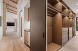 Step into a luxurious walk-in closet featuring custom wood cabinetry and ample storage space.