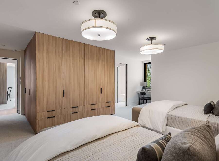 This spacious bedroom features two twin beds, perfect for accommodating guests or family.