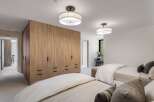 This spacious bedroom features two twin beds, perfect for accommodating guests or family.