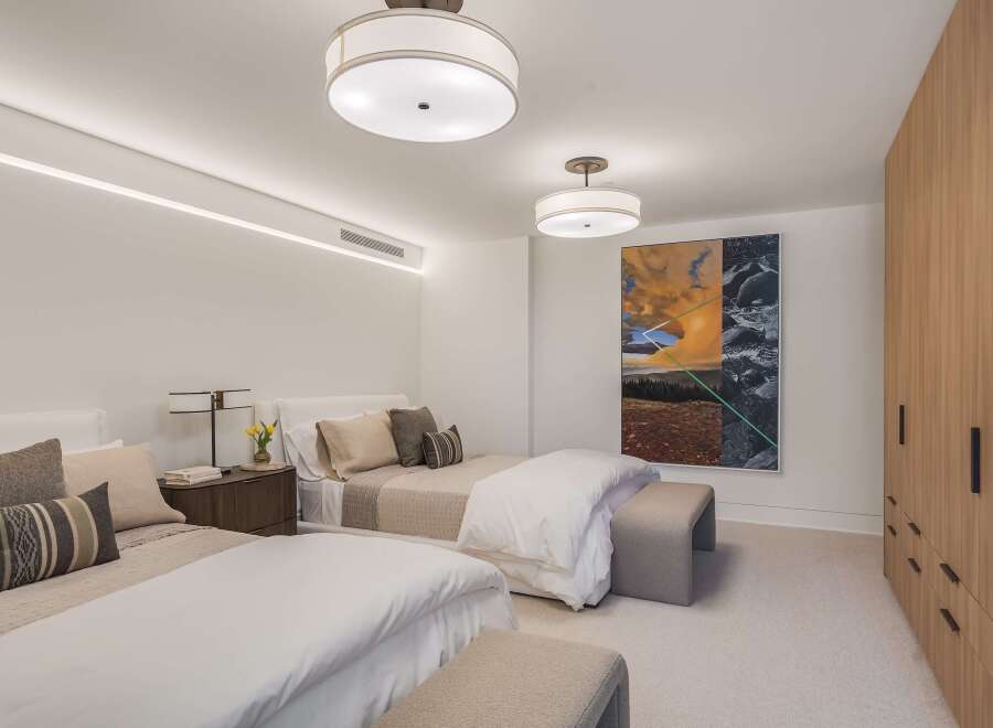 This inviting bedroom features two comfortable beds, perfect for accommodating guests or family.