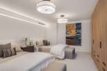This inviting bedroom features two comfortable beds, perfect for accommodating guests or family.