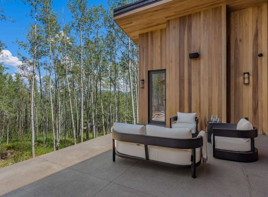 Experience modern luxury with this stunning outdoor living space, featuring sleek, contemporary furniture perfect for relaxing or entertaining.