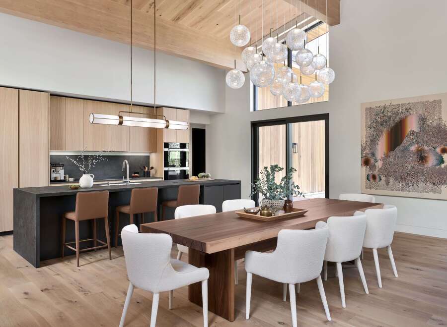 Experience modern luxury in this open-concept living space, featuring a gourmet kitchen with sleek cabinetry and a large island perfect for entertaining.