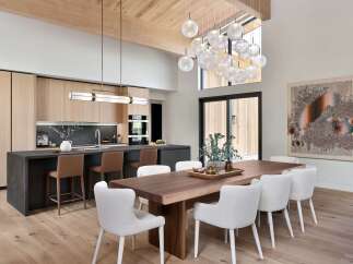 Experience modern luxury in this open-concept living space, featuring a gourmet kitchen with sleek cabinetry and a large island perfect for entertaining.