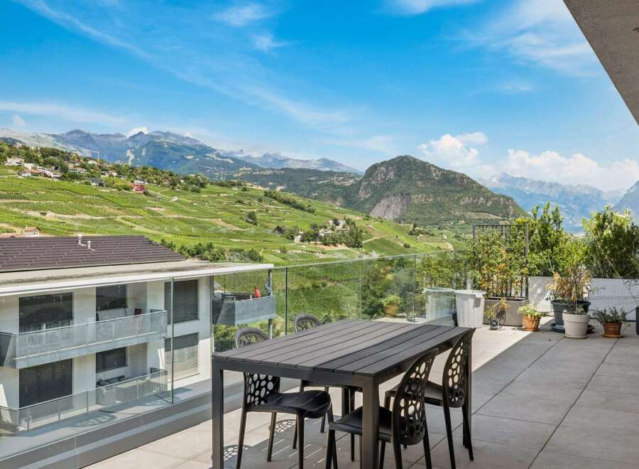 Experience breathtaking panoramic views from this stunning balcony, perfect for al fresco dining or enjoying your morning coffee.