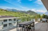 Experience breathtaking panoramic views from this stunning balcony, perfect for al fresco dining or enjoying your morning coffee.
