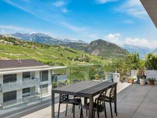 Experience breathtaking panoramic views from this stunning balcony, perfect for al fresco dining or enjoying your morning coffee.