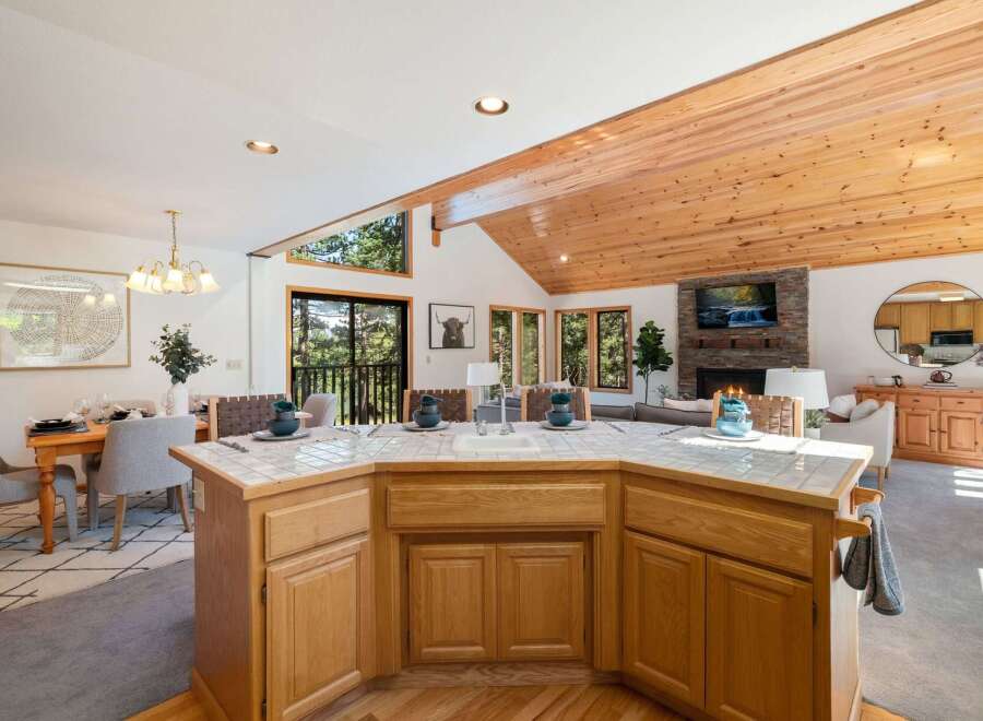 Experience the perfect blend of rustic charm and modern comfort in this stunning open-concept living space.