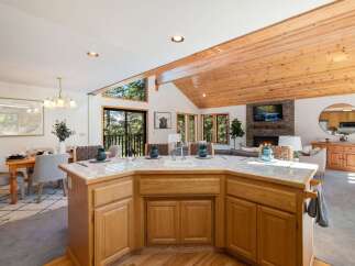 Experience the perfect blend of rustic charm and modern comfort in this stunning open-concept living space.