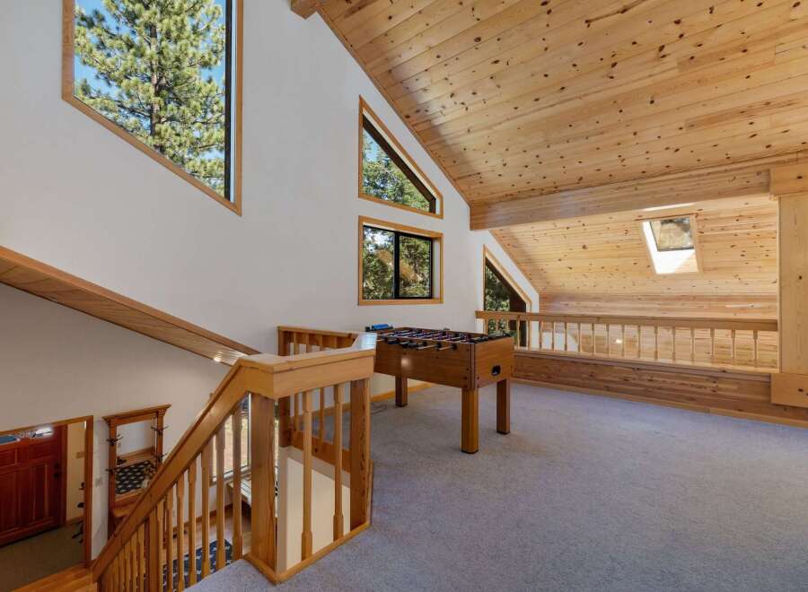 Experience the charm of this mountain retreat, featuring a spacious loft area perfect for recreation and relaxation.