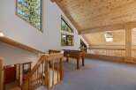 Experience the charm of this mountain retreat, featuring a spacious loft area perfect for recreation and relaxation.