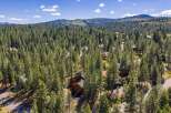 Nestled amidst a dense forest of towering pine trees, this property offers a serene and private retreat.