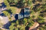 Discover this stunning property nestled among mature pine trees, offering a serene and private retreat.