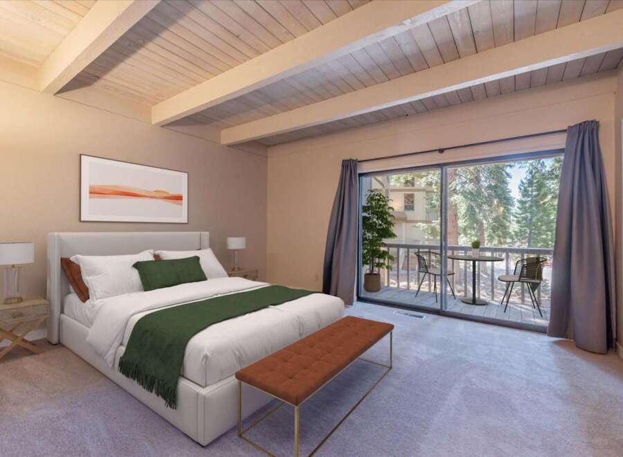 Experience serene mountain living in this beautifully appointed bedroom, featuring a plush king-sized bed and a cozy seating area.