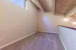 Discover this charming loft space, perfect for a home office or cozy reading nook.