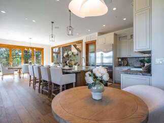 Experience luxurious open-concept living in this stunning kitchen and dining area, perfect for entertaining.