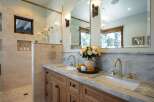 Experience luxury in this stunning master bathroom, featuring a spacious walk-in shower with elegant tilework and a convenient niche for toiletries.