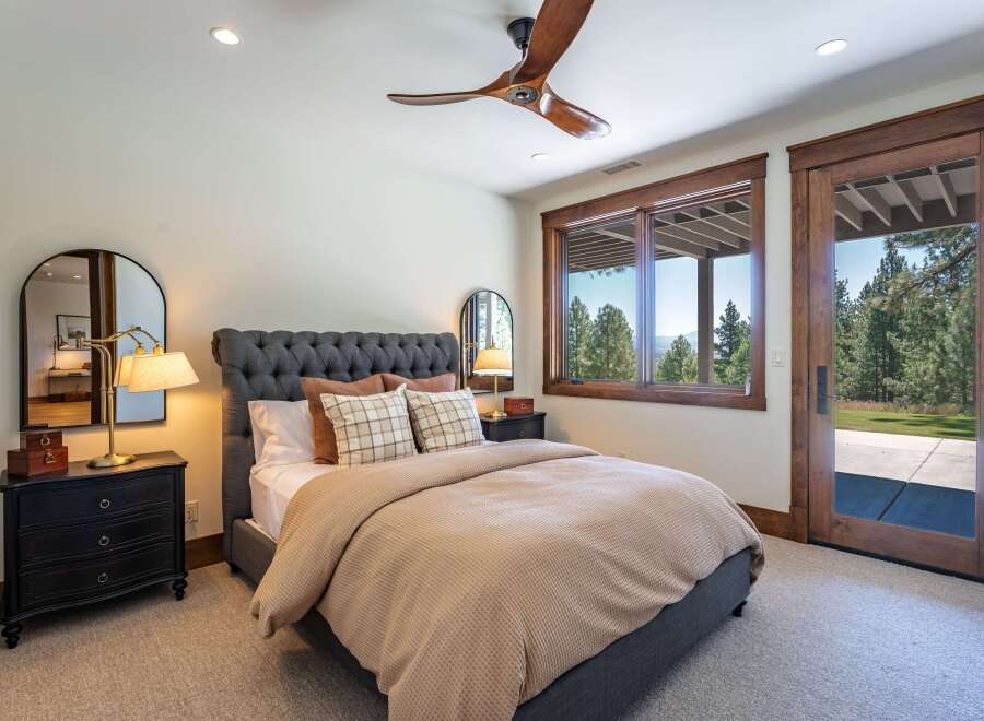 Experience serene living in this charming bedroom featuring a plush tufted headboard and a cozy waffle-knit duvet.
