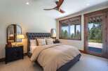 Experience serene living in this charming bedroom featuring a plush tufted headboard and a cozy waffle-knit duvet.